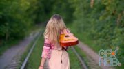 MotionArray – Woman With Guitar Walks On Railway 1026440