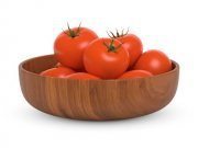 Wooden bowl with tomatoes