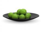 Black dish with lime fruit