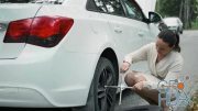 MotionArray – Woman Changing A Car Wheel 1030064