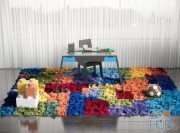 Multi-colored rug, table and LEGO