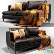 Leather sofa with a plaid