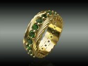 Gold ring with green stones
