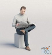 Casual man sitting and reading newspaper