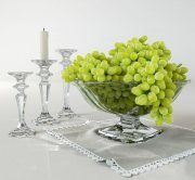 Grapes in vase and candles