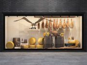Showcase with cheese, meat and wine