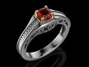 Ring of white metal with red stone