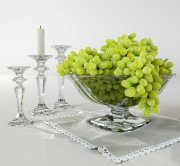 Grapes in vase and candles