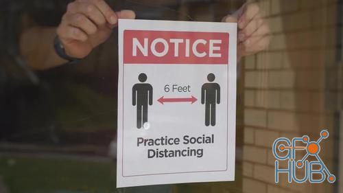 MotionArray – Man Puts Social Distance Sign On Door 1024370