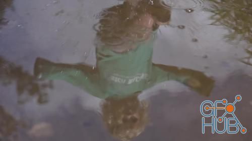 MotionArray – Reflection Of A Child In A Puddle 1023004