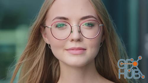 MotionArray – Woman In Glasses Looking At Camera 1019493